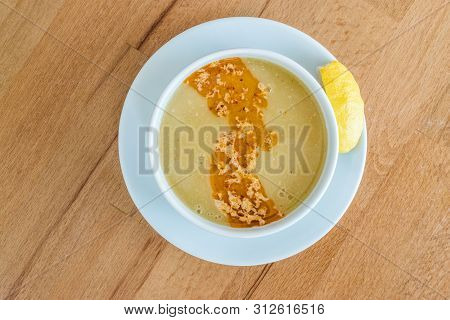Turkish Lentil Soup With Fried Butter Sauce / Mercimek Corbasi At Restaurant.