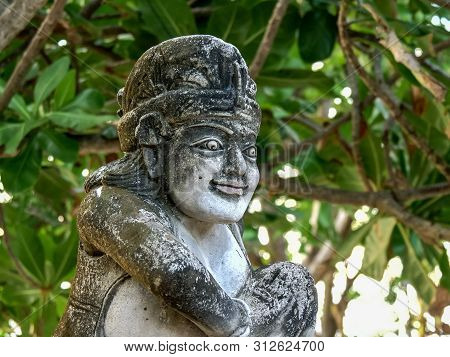Kuta, Indonesia - June, 15, 2017: Close Up Of A Stone Statue At Kuta Beach