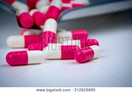 Pink-white Capsule Pills On Stainless Steel Drug Tray. Pharmacy Drugstore. Pharmaceutics Concept. Ph