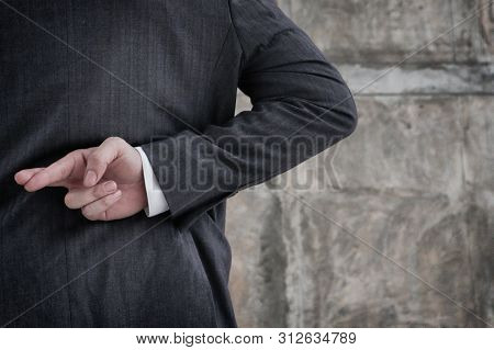Businessman With His Fingers Crossed Behind His Back.dishonest Relationship And Betrayal Concept