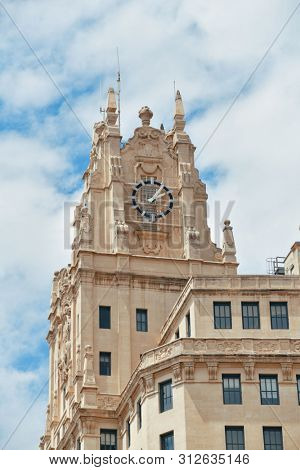 MADRID, SPAIN - MAY 13, 2018: Telefonica Building rise above historical buildings on Gran Via business district.