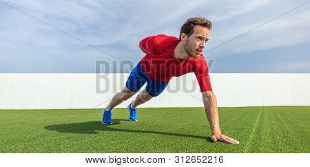 One Arm Pushup bodyweight exercise strong man working out muscles with advanced variation of push-ups. Push up training at gym.