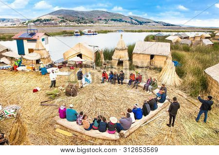 Uros, Peru - Jan 5, 2019. Tourists visit Uros floating islands, Titicaca lake, Peru. South America.