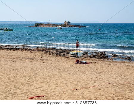 Malia, Crete, Greece - Juni 18, 2019: People Are Resting On A Sunny Day At The Beach In Malia, Crete