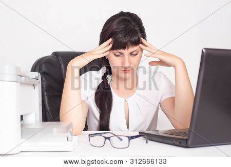 Office Worker Girl, Business Woman Holding Her Head A Concept Of Headache And Anxiety Due To Stress 