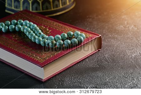 Islamic Book Koran With Rosary Beads And Kopiah Hat For Muslims