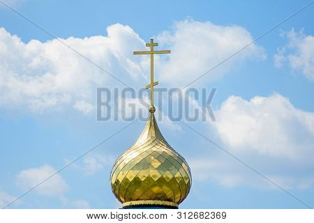 View To Gold Church Cross In Summer Sunny Day And Blue Sky. Concept Of Religiosity