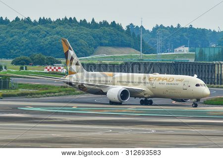 Passenger Airplane At Tokyo Narita Airport