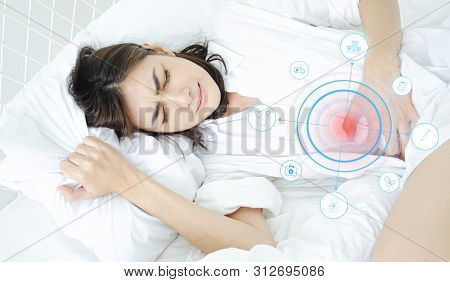 Asian Girl Has Abdominal Pain.when Is Menstruation.catch His Stomach.women Have Bladder Pain.medical