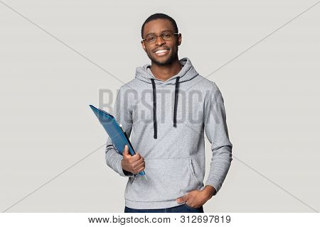 Smiling Black Male Student Stand Holding Binder Case