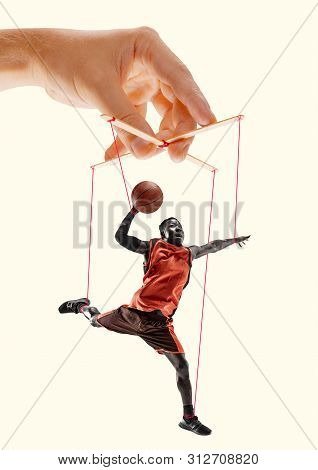 Man Like A Puppet In Somebodies Hands On Yellowbackground. Concept Of Unfair Manipulation, Phycology