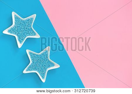 Blue Nonpareils Cake Candy Sprinkles In Two White Star Bowls On Pink Blue Background In Flat Lay Wit