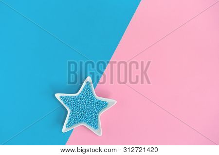 Blue Nonpareils Cake Candy Sprinkles In One White Star Bowl On Pink Blue Background In Flat Lay With