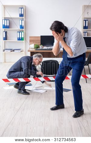 Forensic investigator investigating theft in the office