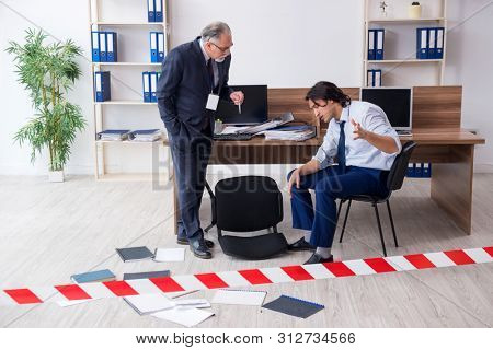 Forensic investigator investigating theft in the office