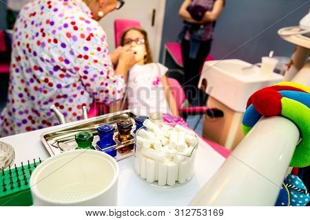 Set Of Dentist Tools And Equipment On Clinic Desktop