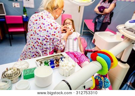 Set Of Dentist Tools And Equipment On Clinic Desktop
