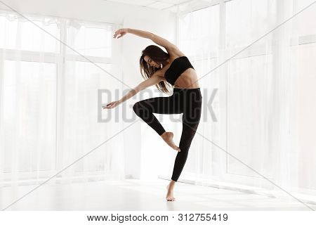 Gorgeous Lady Dancing Contemp And Ballet In Modern Studio. Free Space For Text