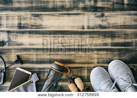 Fitness And Healthy Active Lifestyle Background Concept.  Training Sneakers,  Jump Rope, Water Bottl