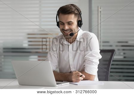 Smiling Business Man Wearing Wireless Headset Make Conference Video Call