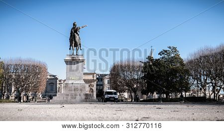 Montpellier, France - January 2, 2019: City Employee Who Cleans The Statue Of Louis Xiv Degraded By 