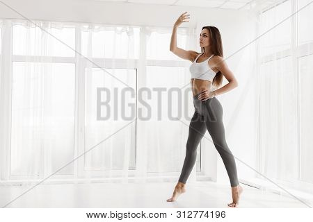 Lady Dancing Modern Ballet And Contemp Alone Next To Panoramic Windows In Spacious Dance Class. Empt