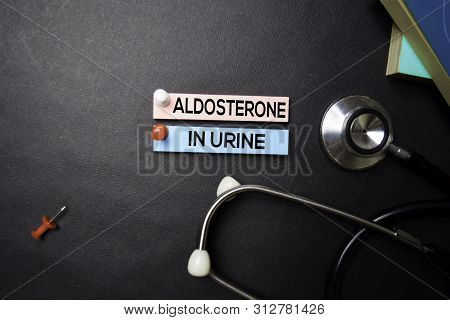 Aldosterone In Urine Text On Sticky Notes. Top View Isolated On Black Background. Healthcare/medical