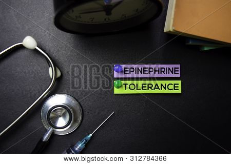 Epinephrine Tolerance Text On Sticky Notes. Top View Isolated On Black Background. Healthcare/medica