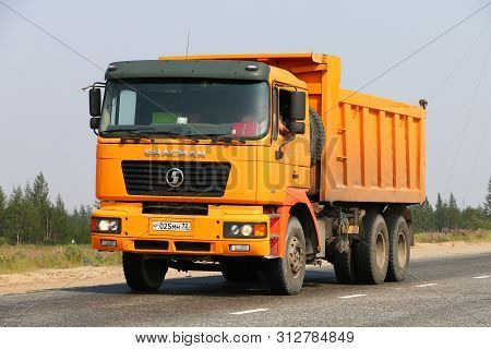 Novyy Urengoy, Russia - July 20, 2019: Yellow Dump Truck Shaanxi Sx3254 Shacman At The Interurban Ro