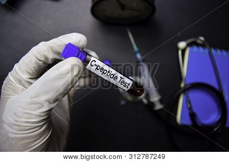 C-peptide Test Text With Blood Sample. Top View Isolated On Black Background. Healthcare/medical Con