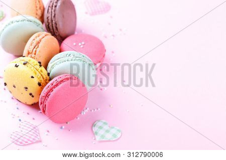 Colorful French Macarons On Pink Background With Copy Space, Traditioanal Dessert In France