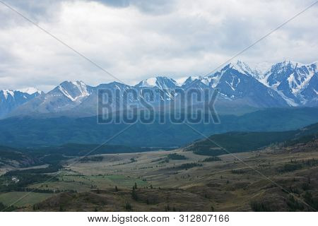 Summer in Kurai steppe and North-Chui ridge of Altai mountains, Russia. Cloud day.