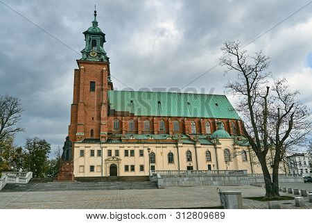 Gothic Cathedral Church With Towers In Autumn In Gniezno