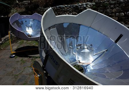 Sagarmatha national park, Nepal - May 17, 2019: Parabolic solar heaters for hot water in Pangboche village, Everest trek, Sagarmatha national park, Solukhumbu, Nepal