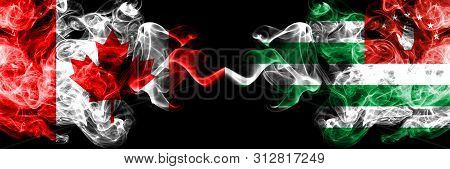 Canada Vs Abkhazia, Abkhazian Smoky Mystic Flags Placed Side By Side. Thick Colored Silky Smoke Flag