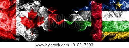 Canada Vs Central African Republic Smoky Mystic Flags Placed Side By Side. Thick Colored Silky Smoke