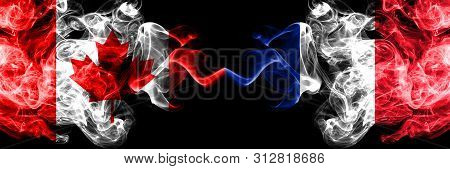 Canada Vs France, French Smoky Mystic Flags Placed Side By Side. Thick Colored Silky Smoke Flags Of 