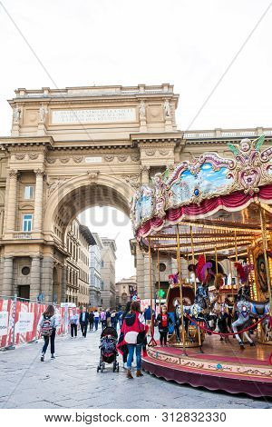 Florence, Italy - April, 2018: Tourists And Locals At The Republic Square Next To The Carrousel And