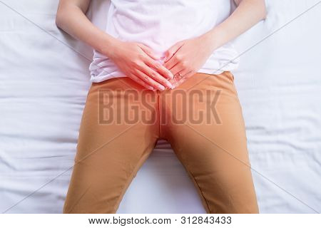 Hands Woman Holding Her Crotch And Lying On Bed,female Need To Pee,urinary Stain Incontinence