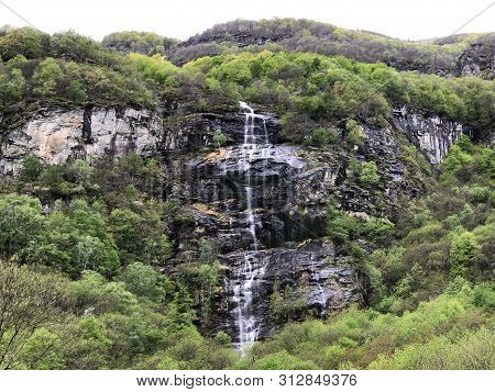 Seasonal Waterfall In The Village Of Cevio (the Maggia Valley Or Valle Maggia Or Maggiatal) - Canton