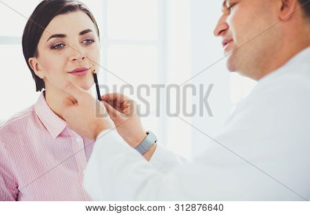 The Patient And His Doctor In Medical Office