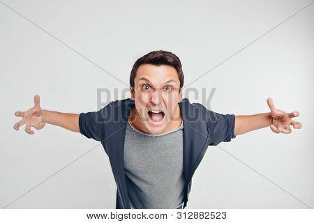 Portrait Of A Man Who Screams. Isolated On White Background. Concept Of Freedom Of Expression Of Fee