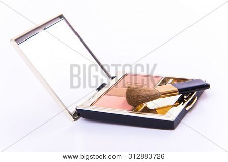 blush with mirror and a brush, isolated