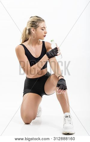 Woman After Sport Drinking Water From Bottle