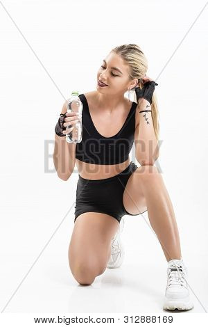 Woman After Sport Drinking Water From Bottle