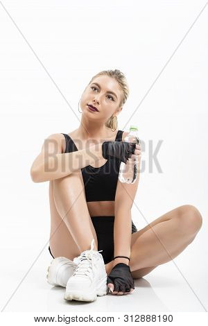 Woman After Sport Drinking Water From Bottle