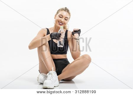 Woman After Sport Drinking Water From Bottle