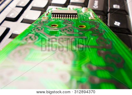 Green Electronic Board On The Keyboard. Repair Of Equipment. System Administrator.