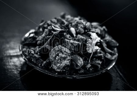Famous Indian & Gujarati Snack Dish In A Glass Plate On Wooden Surface I.e. Patra Or Paatra Consisti