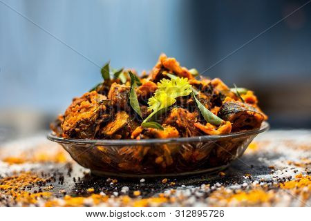 Famous Indian & Gujarati Snack Dish In A Glass Plate On Wooden Surface I.e. Patra Or Paatra Consisti